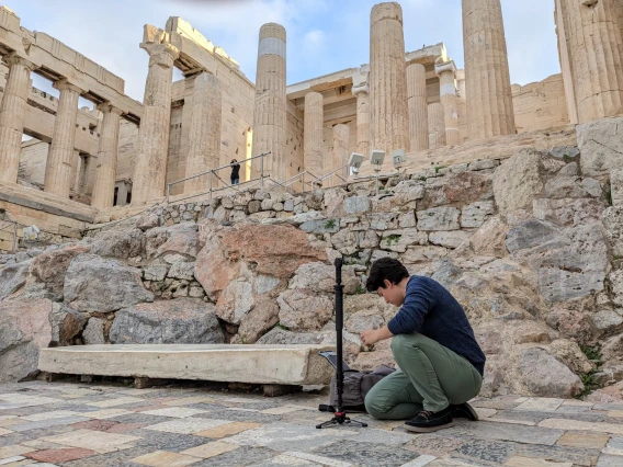 Person kneeling down working with equipment