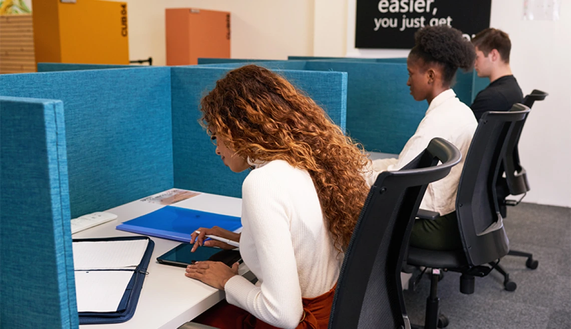 Shot of three students working in a testing environment